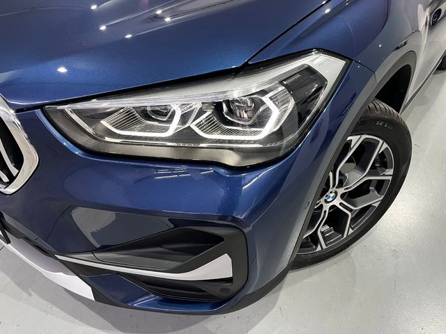 BMW X1 sDrive18d color Naranja. Año 2021. 110KW(150CV). Diésel. En concesionario Unicars Ponent de Lleida