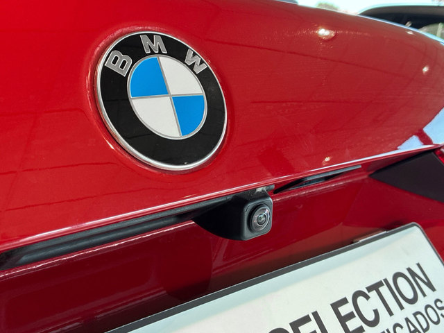 BMW Serie 1 118d color Rojo. Año 2024. 110KW(150CV). Diésel. En concesionario BMW Marcos Automoción de Valencia