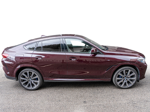 Fotos de BMW X6 xDrive30d color Violeta. Año 2022. 210KW(286CV). Diésel. En concesionario Caetano Cuzco, Alcalá de Madrid